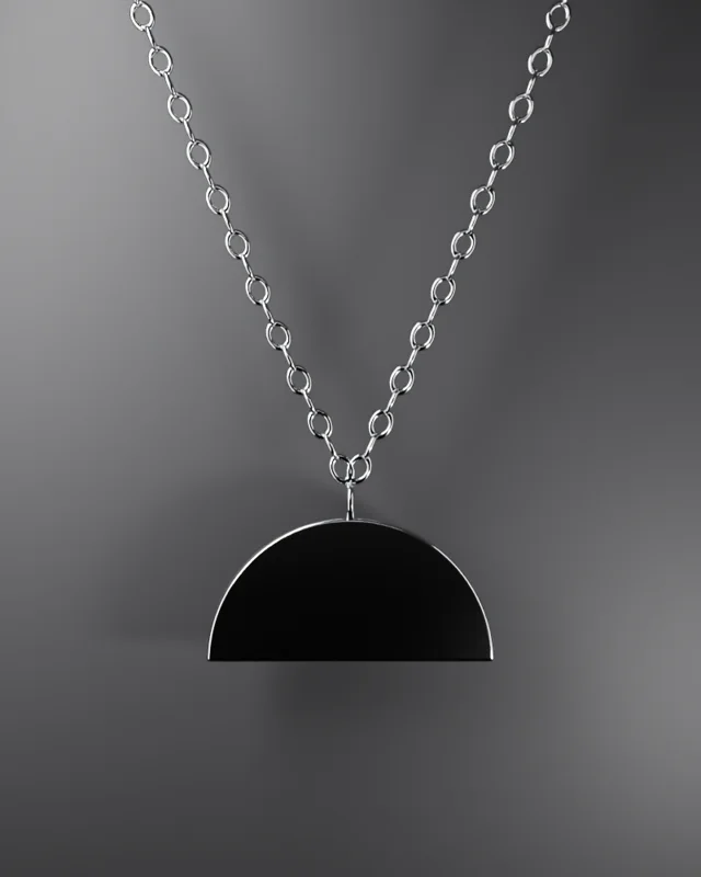 Half-moon pendant on black