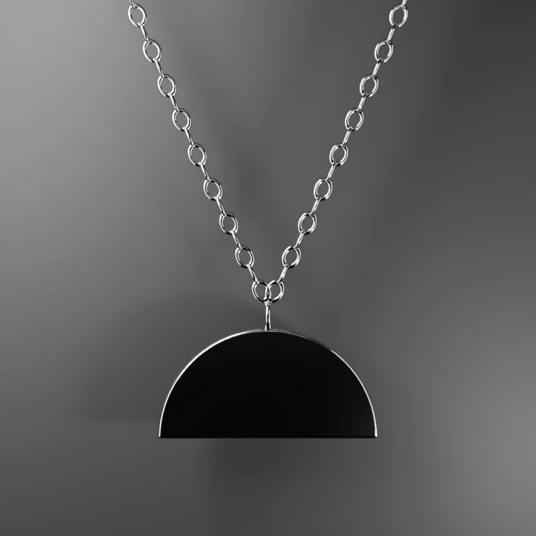 Half-moon pendant in polished silver on a fine chain